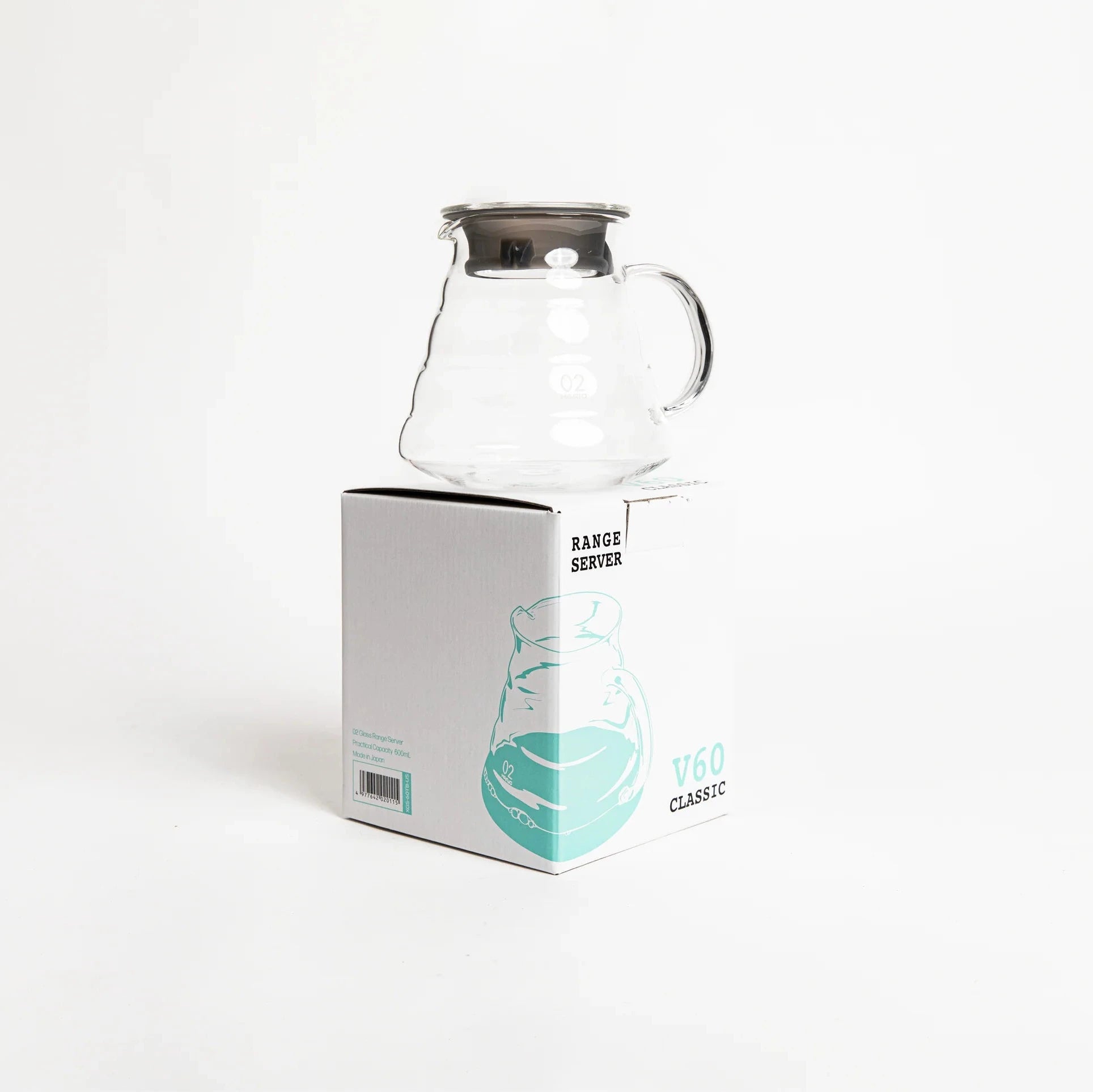 Clear glass carafe on a white background with a branded box.